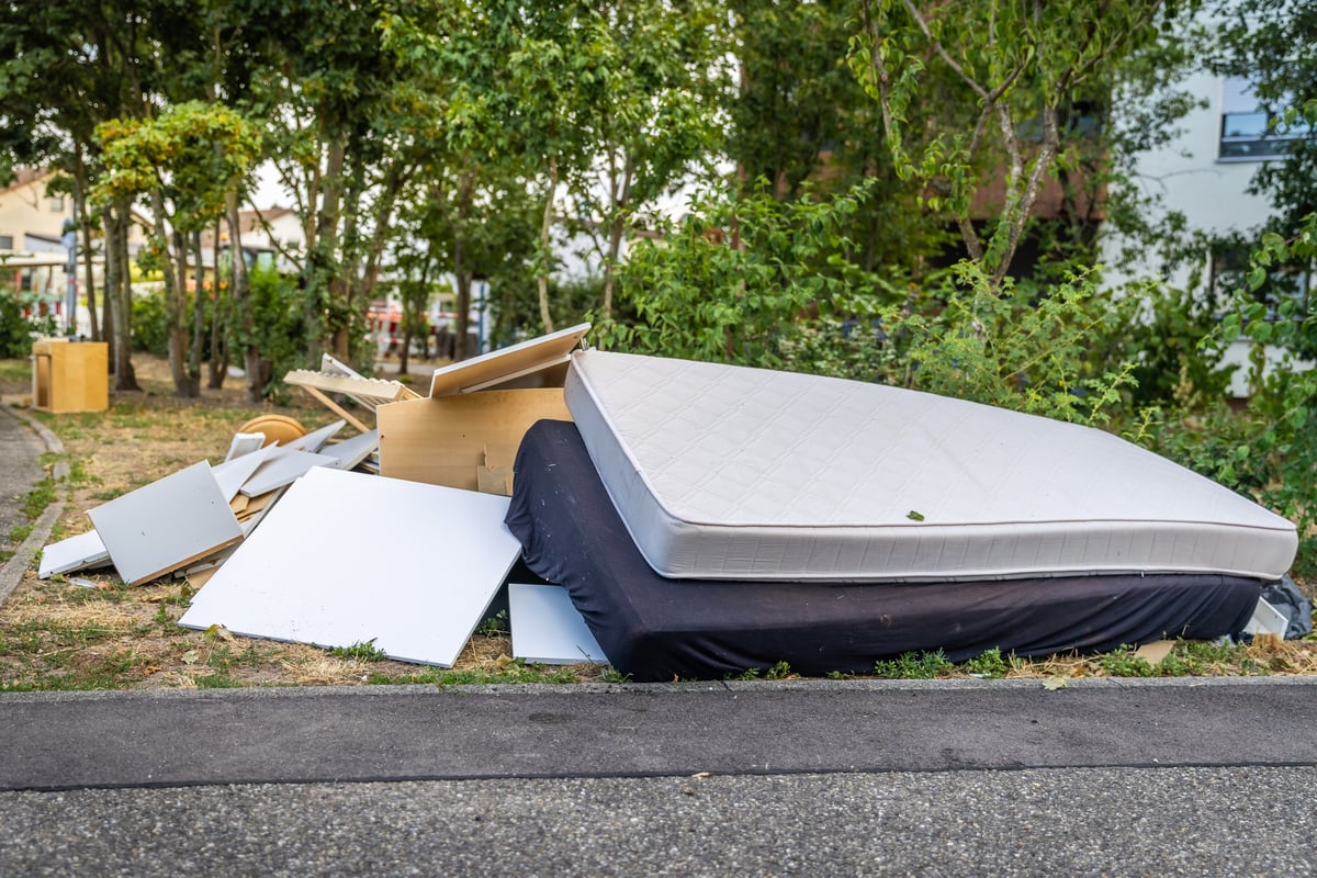 Bulk garbage day concept, miscellaneous rubbish items put on a street for council bulk waste collection, bulky waste and waste management