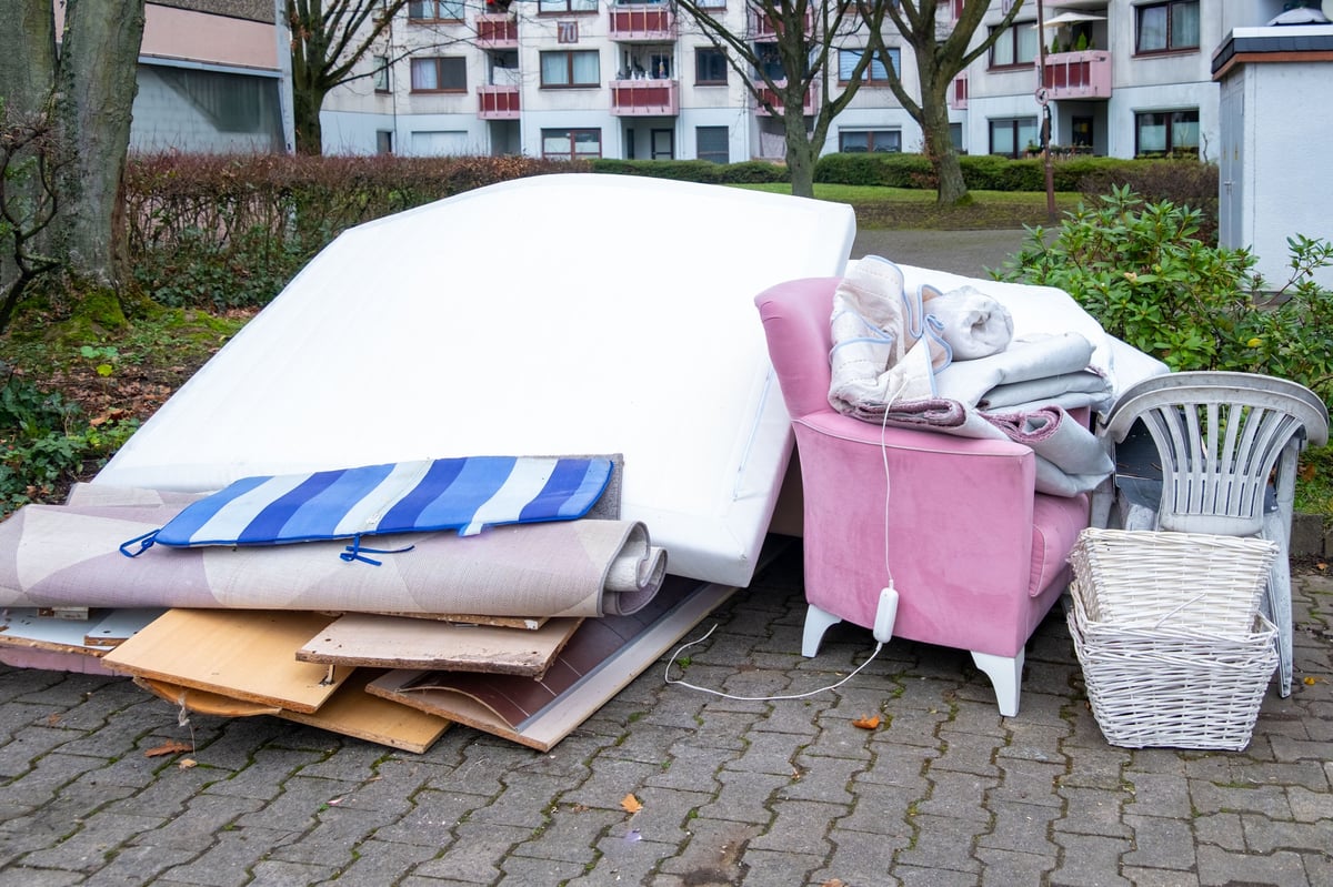 Bulky waste reduction, large pile discarded furniture and wooden panels, renovation or decluttering process, used things on street, municipal waste management